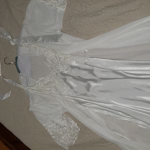 Intimate sleepwear. White lace nightgown and robe
